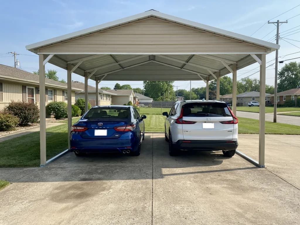 Toyota Camry and Honda CR-V parked side by side in a 24x24 carport with open depth behind them