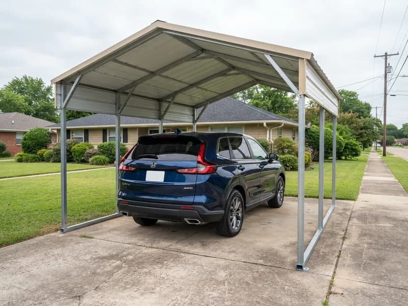 Freestanding metal carport with a vertical roof and tan panels sheltering a 2023 Honda CR-V on a suburban driveway